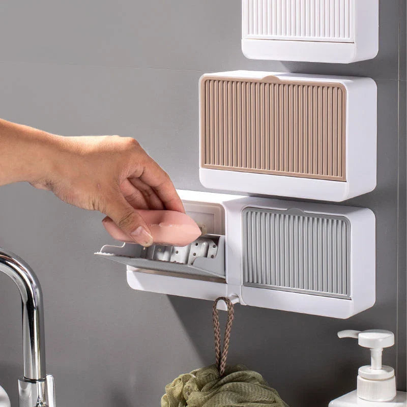 Stylish bathroom soap dispenser with wall-mounted storage box and drainage design