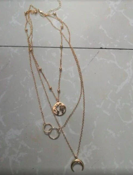 Stunning multi-layer boho moon pendant necklace with intricate design and electroplated finish