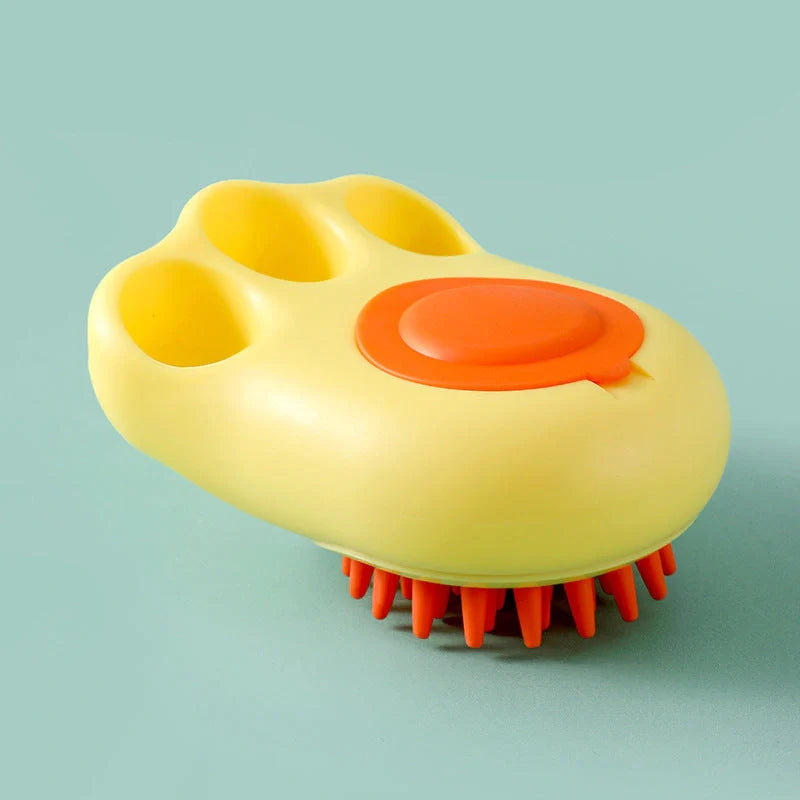 Claw-shaped pet grooming brush in pink, blue, yellow, and grey