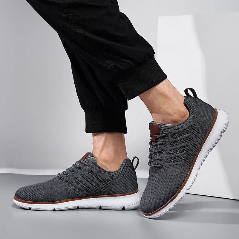 Men's black lace-up mesh sneakers with round toe design