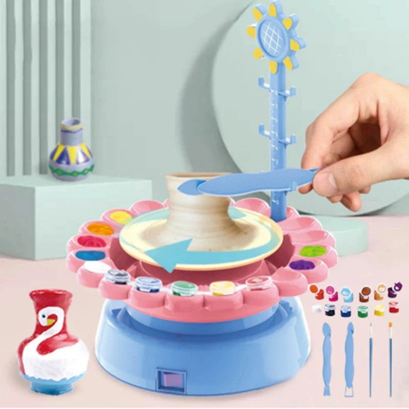 A blue electric pottery wheel kit with various clay and painting accessories for making unique pottery pieces