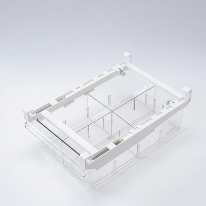 Transparent rectangular storage box with modular grid system for organised storage in kitchen or office