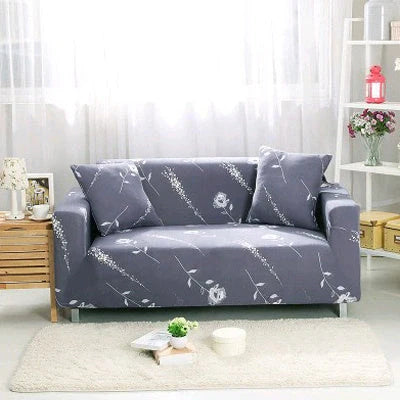 Stretchable geometric print sofa cover on a three-seater sofa