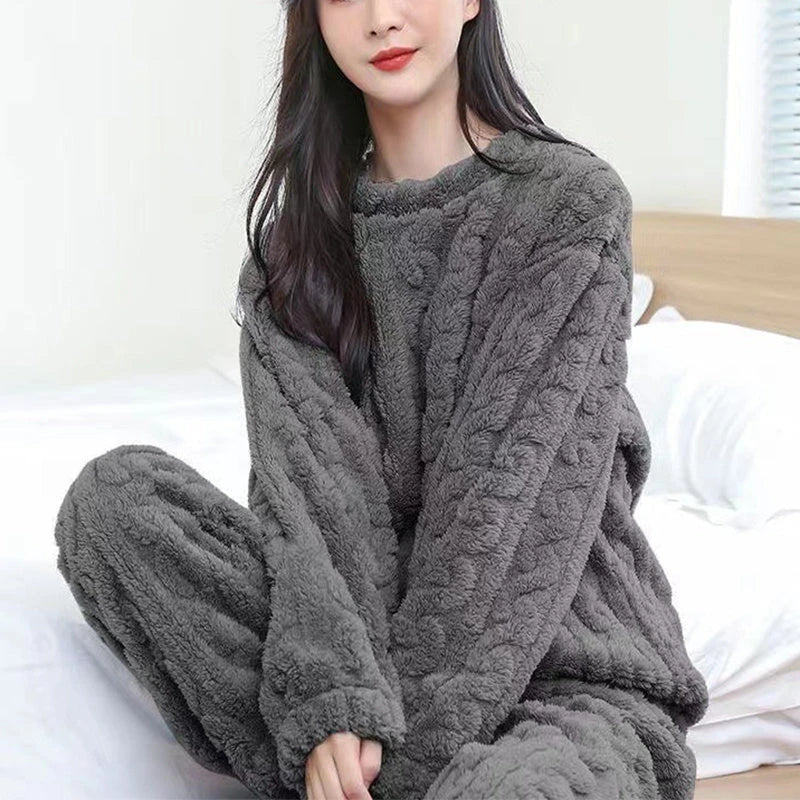 Cozy coral velvet pajama set with long sleeves and drawstring trousers for indoor and outdoor casual wear