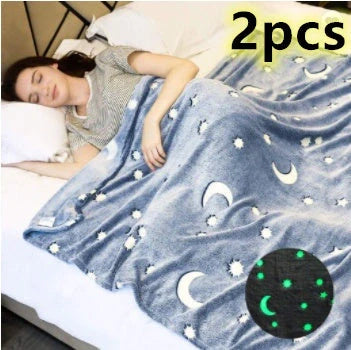 Glowing polyester wool blanket with stars and moons design, perfect for cosy nights