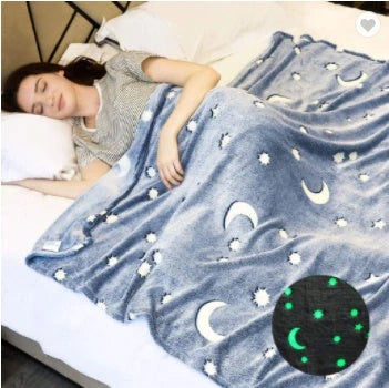 Glowing polyester wool blanket with stars and moons design, perfect for cosy nights