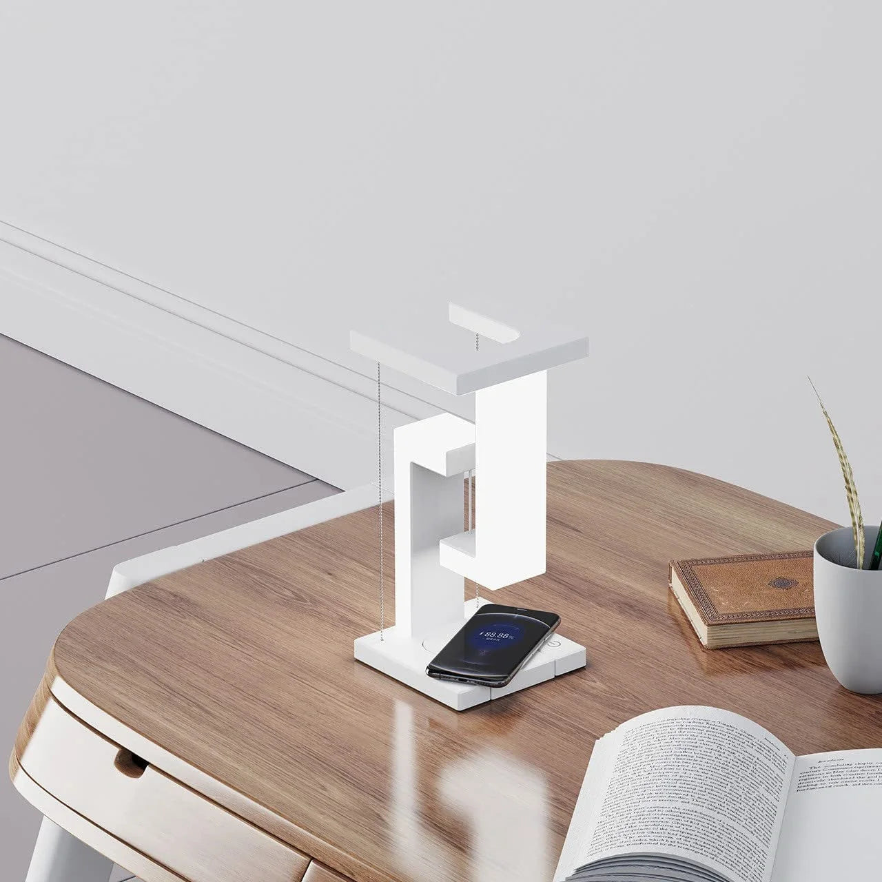 Floating table lamp with wireless charging for smartphones in modern minimalist design