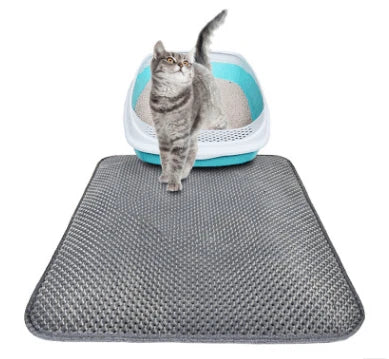 Honeycomb-patterned cat litter mat with a waterproof base, designed to trap litter and protect floors from leaks and spills