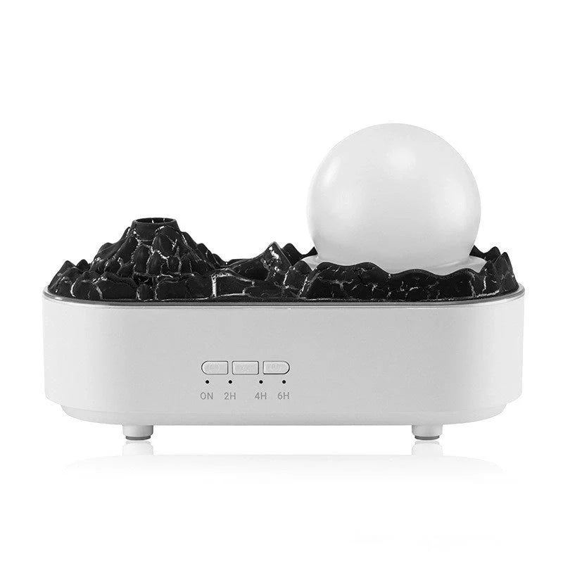 USB Volcano Humidifier on a desktop, emitting a heavy fog for air moisture