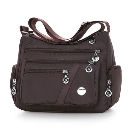 Ladies waterproof nylon oxford crossbody bag in various colors with multi-layer storage