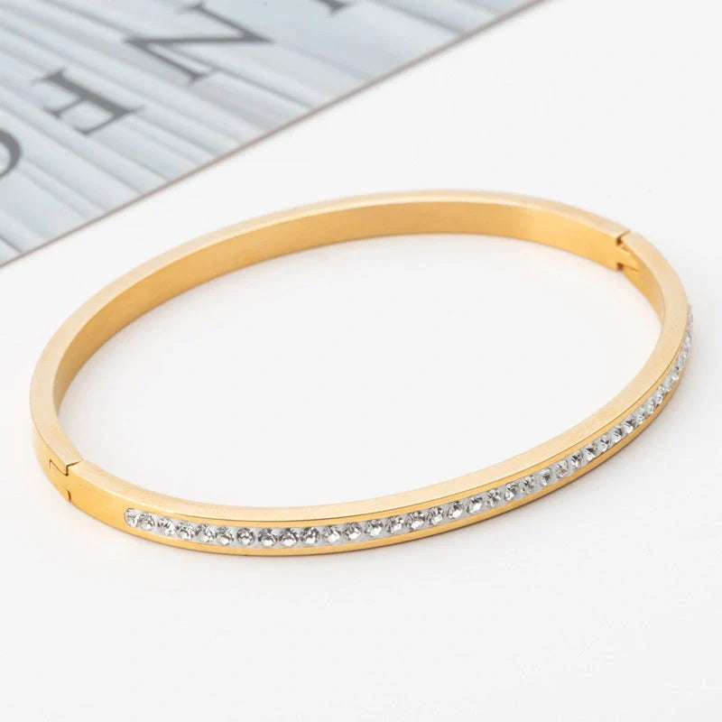 Single row stainless steel bracelet with diamond opening in gold, rose gold, or steel colour
