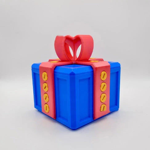 Clever Gag Gift Box - Unique 3D printed design in various colors with a humorous "trouble" concept for prank gifts and creative holiday presents