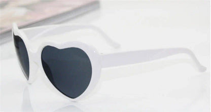 Stylish heart-shaped sunglasses with unique lens design that transforms light into enchanting special effects
