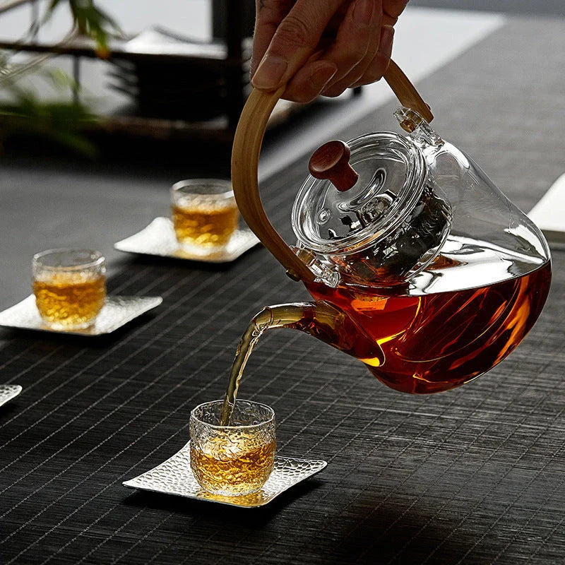 Elegant Japanese-style glass teapot with bamboo handle, perfect for brewing loose-leaf teas