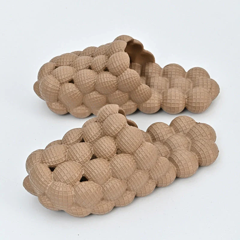 Comfortable massage bubble slides with breathable mesh upper and non-slip soles for indoor relaxation and pampering