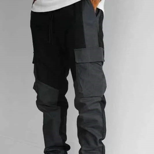 Men's large pocket stitching trousers in black and grey, featuring multiple pockets and a loose fit.