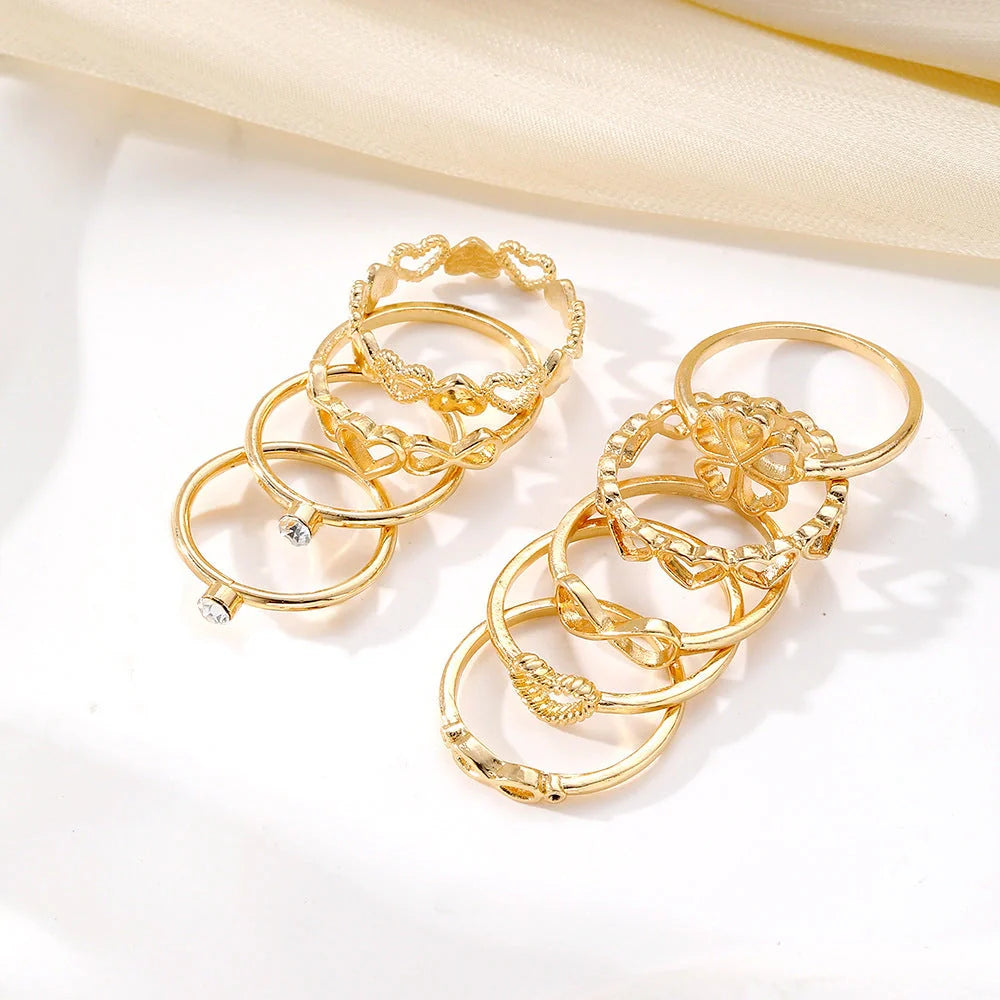 Gold-coloured heart-shaped, geometric, and butterfly design rings set
