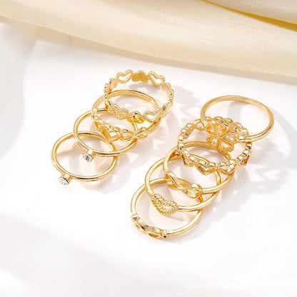 Gold-coloured heart-shaped, geometric, and butterfly design rings set
