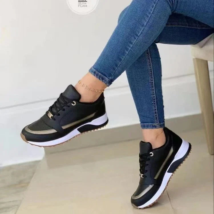 Stylish lace-up sneakers with synthetic leather upper and cushioned sole for casual comfort and versatile style.