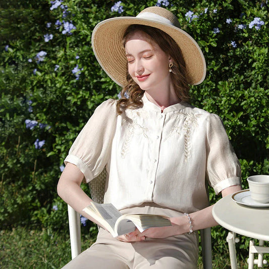 Elegant silk blend blouse with Chinese-inspired puff sleeves and a timeless design
