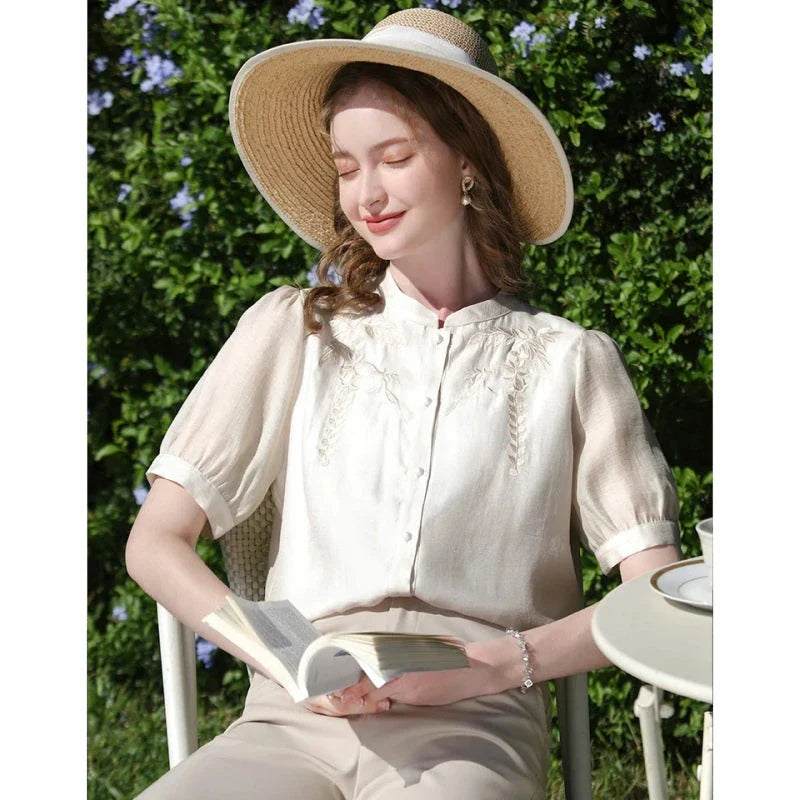 Elegant silk blend blouse with Chinese-inspired puff sleeves and a timeless design