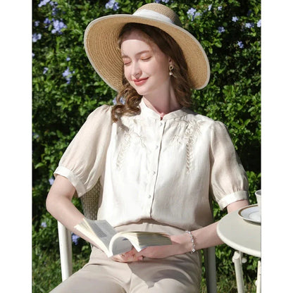 Elegant silk blend blouse with Chinese-inspired puff sleeves and a timeless design