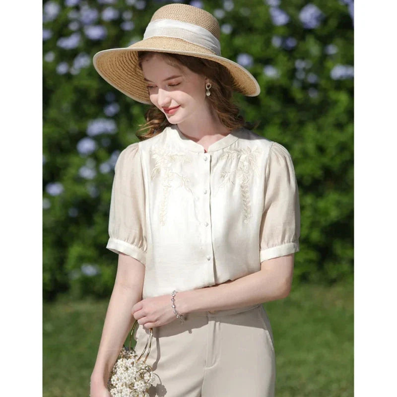 Elegant silk blend blouse with Chinese-inspired puff sleeves and a timeless design