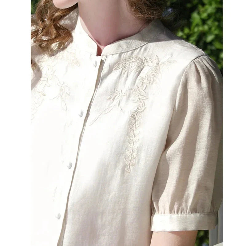 Elegant silk blend blouse with Chinese-inspired puff sleeves and a timeless design