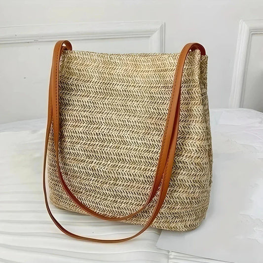 Bohemian straw woven shoulder bag with a compact yet spacious design, perfect for summer outings and beach getaways.