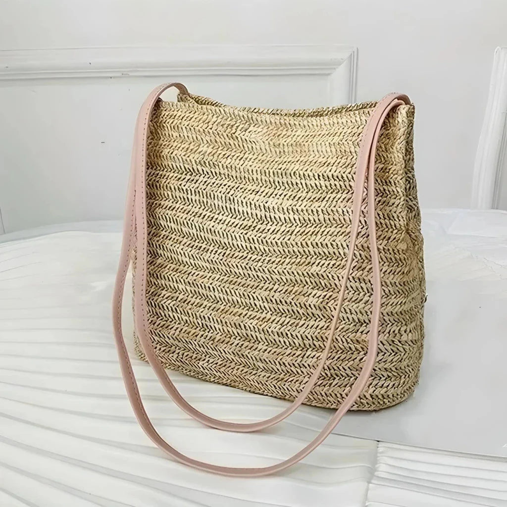Bohemian straw woven shoulder bag with a compact yet spacious design, perfect for summer outings and beach getaways.