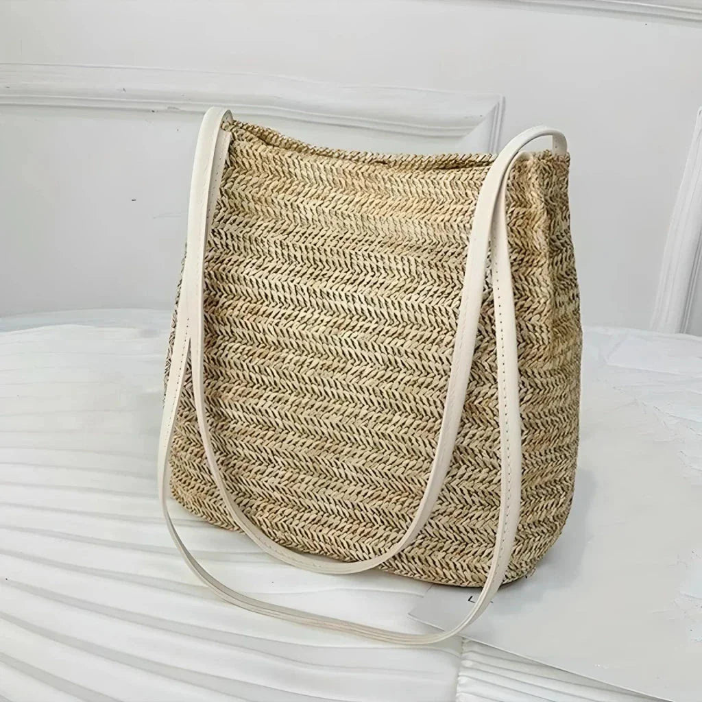 Bohemian straw woven shoulder bag with a compact yet spacious design, perfect for summer outings and beach getaways.