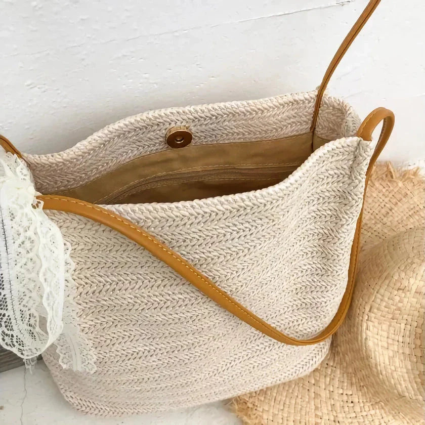 Bohemian straw woven shoulder bag with a compact yet spacious design, perfect for summer outings and beach getaways.