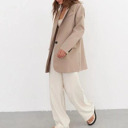 Women's oversized blazer in khaki color, featuring a classic design with a subtle button detail for a sophisticated look.