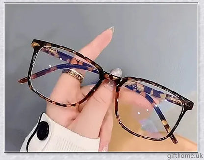 A pair of stylish, blue light blocking glasses in a variety of frame colors for eye protection and sleep support