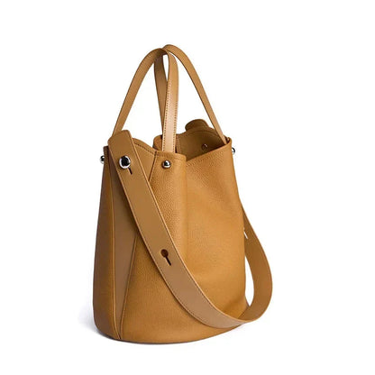 Luxurious genuine leather bucket shoulder bag with adjustable strap and interior pockets, perfect for British women's everyday use
