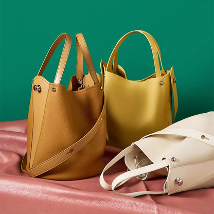 Luxurious genuine leather bucket shoulder bag with adjustable strap and interior pockets, perfect for British women's everyday use