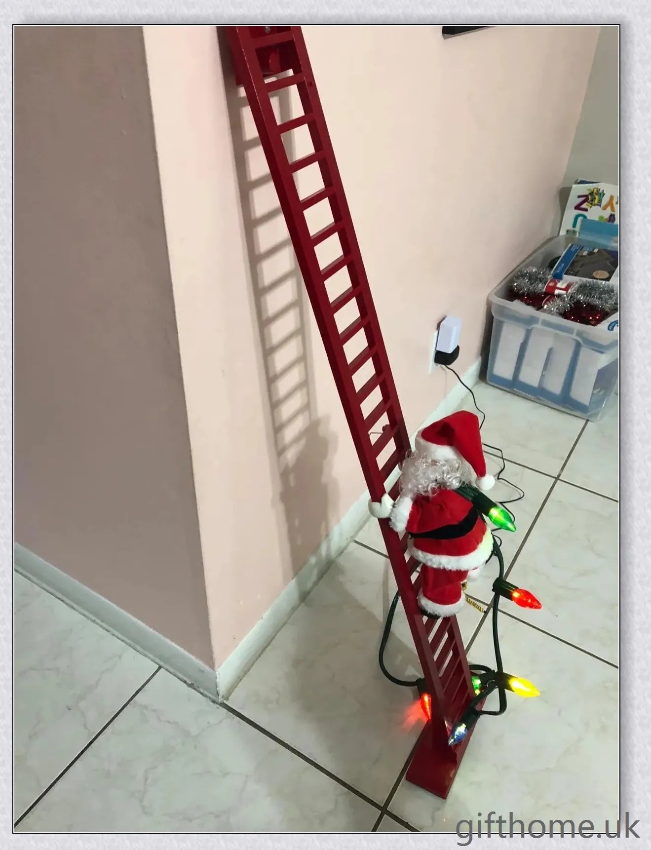 Climbing Santa - A festive Christmas decoration with a Santa Claus figure climbing up and down a ladder while playing Jingle Bells