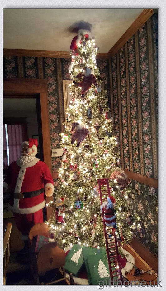 Climbing Santa - A festive Christmas decoration with a Santa Claus figure climbing up and down a ladder while playing Jingle Bells