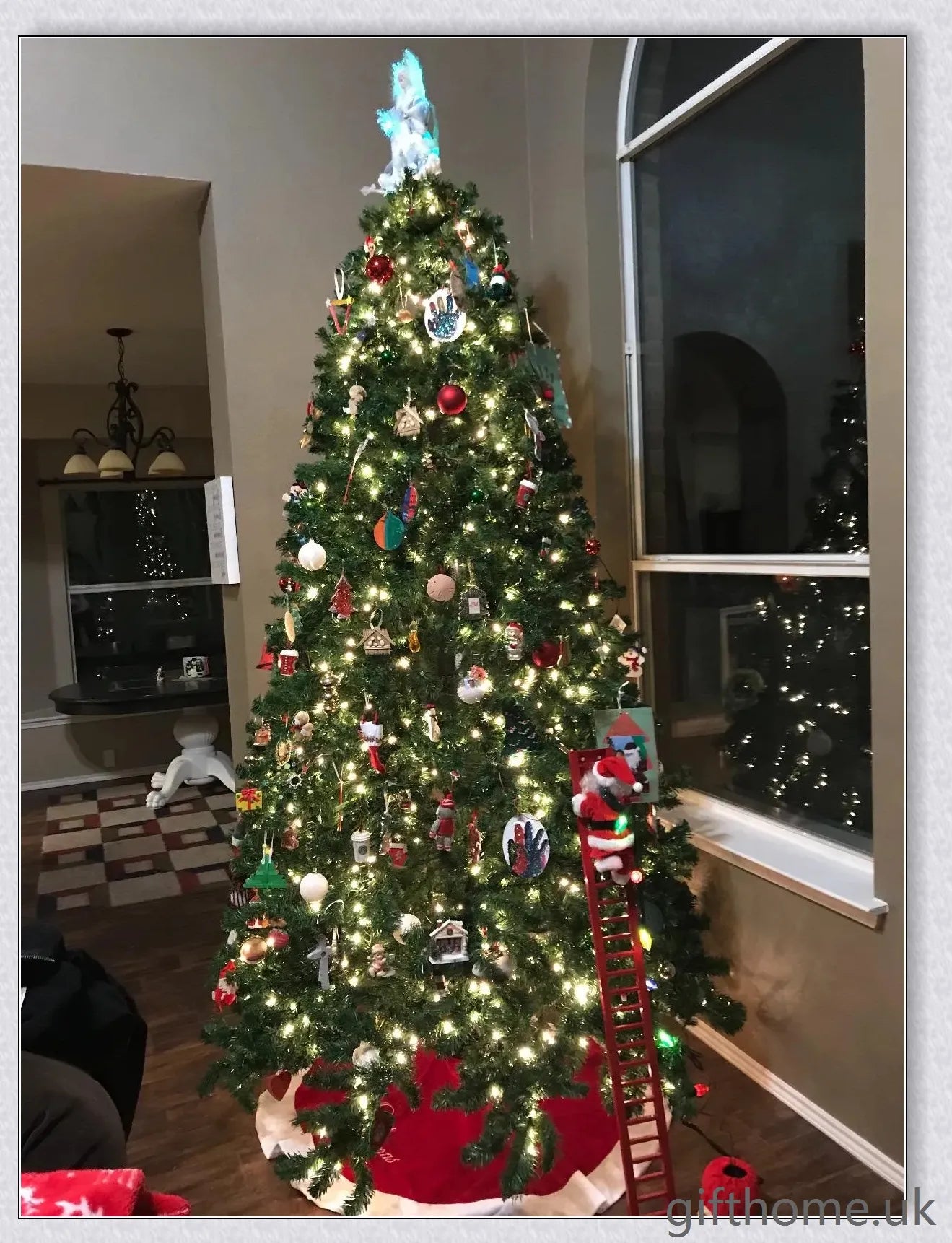 Climbing Santa - A festive Christmas decoration with a Santa Claus figure climbing up and down a ladder while playing Jingle Bells