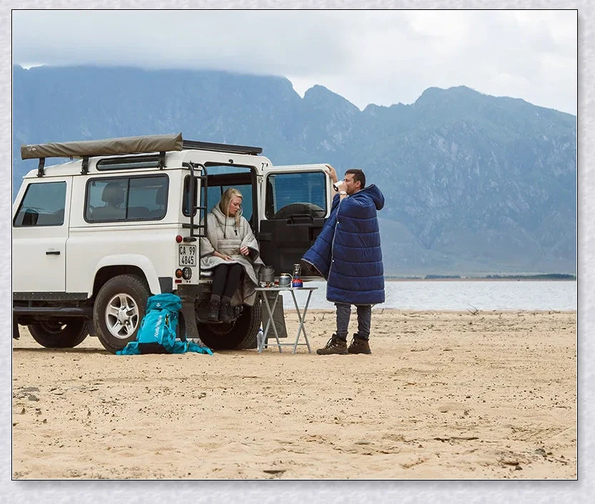 Sleeping Bag Hoodie Poncho in various colours, featuring a cosy design for outdoor activities