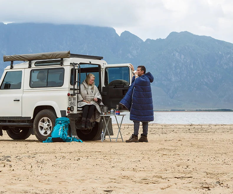 Sleeping Bag Hoodie Poncho in various colours, featuring a cosy design for outdoor activities
