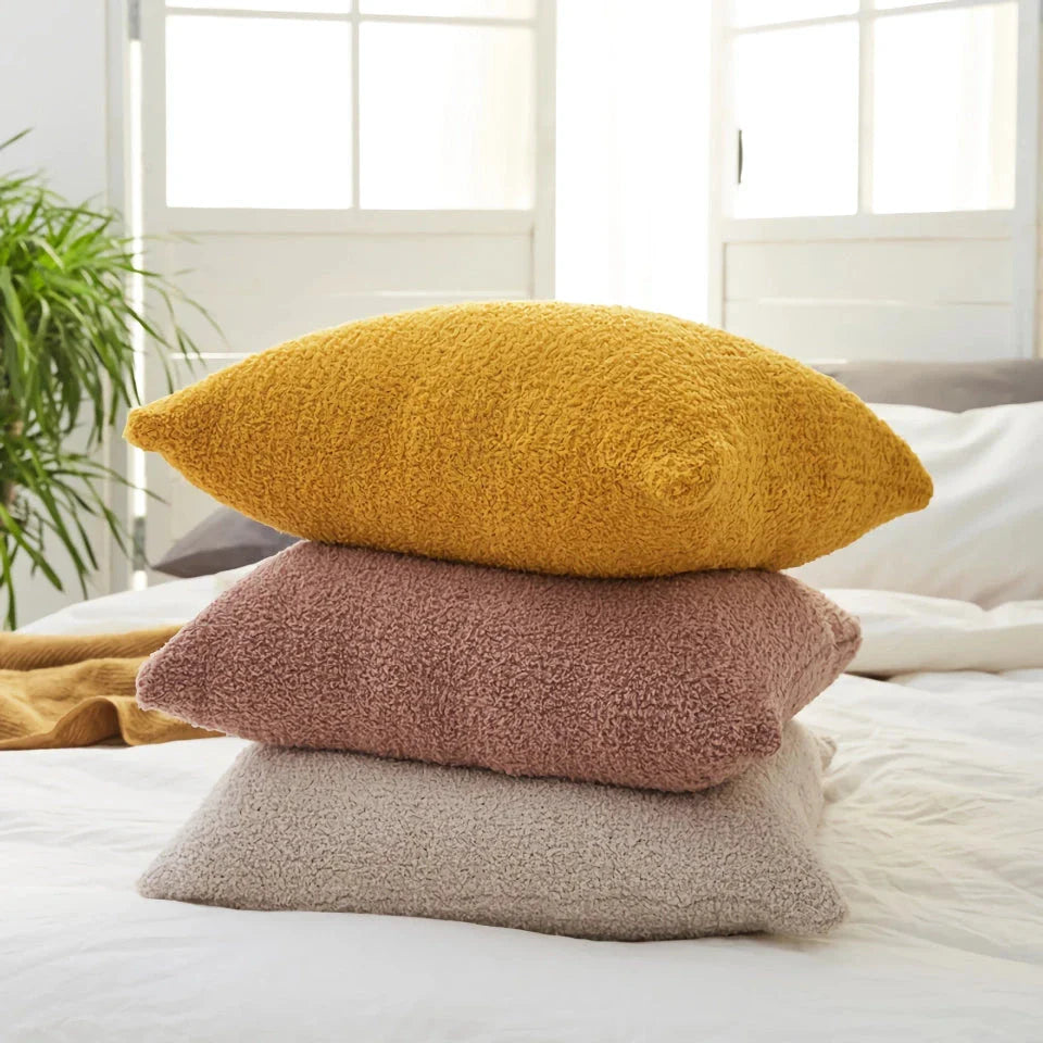 Cosy plush sofa cushion cover made of soft and fluffy microfibre material in a solid yellow colour
