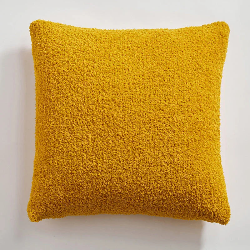 Cosy plush sofa cushion cover made of soft and fluffy microfibre material in a solid yellow colour