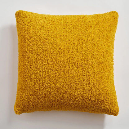 Cosy plush sofa cushion cover made of soft and fluffy microfibre material in a solid yellow colour