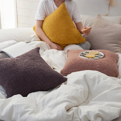 Cosy plush sofa cushion cover made of soft and fluffy microfibre material in a solid yellow colour