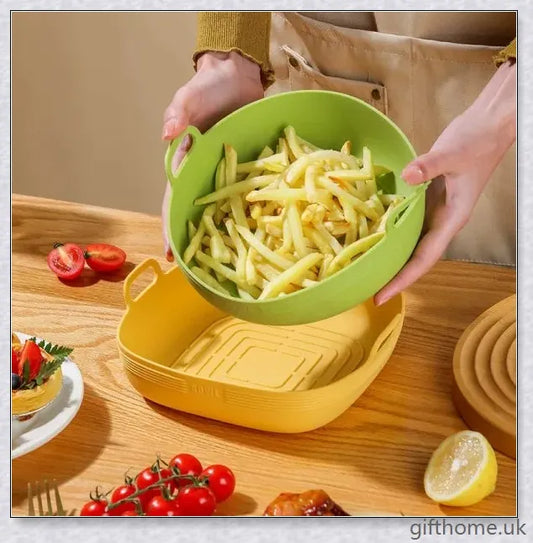 Silicone air fryer bowl in yellow and green colours, featuring square and round shapes for versatile cooking