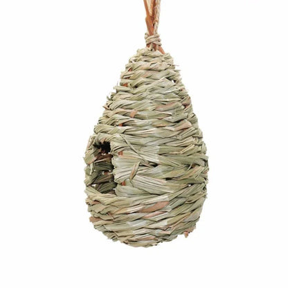 A natural straw bird's nest with a cosy, inviting design to provide a comfortable home for birds.