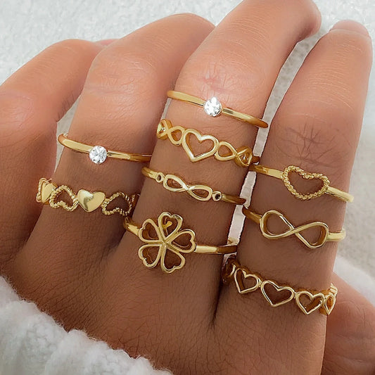 Gold-coloured heart-shaped, geometric, and butterfly design rings set