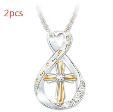Elegant two-tone cross pendant with diamond-like accent, versatile and durable alloy design for everyday or special occasions.