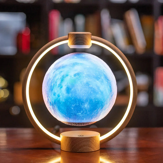 Levitating Bluetooth speaker with moon-shaped orb, colour-changing LED lights, and wooden base
